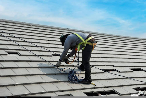 A man doing roof repairs in Cairns