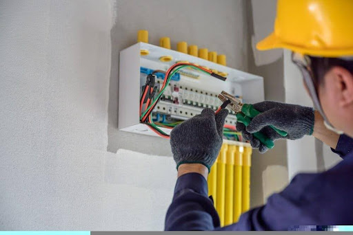 electrical in Cairns working on a breaker box