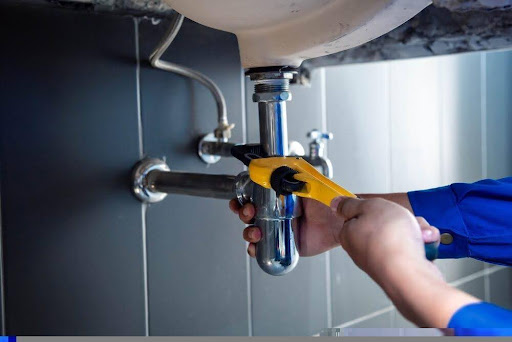 plumbers in Cairns working on sink drains